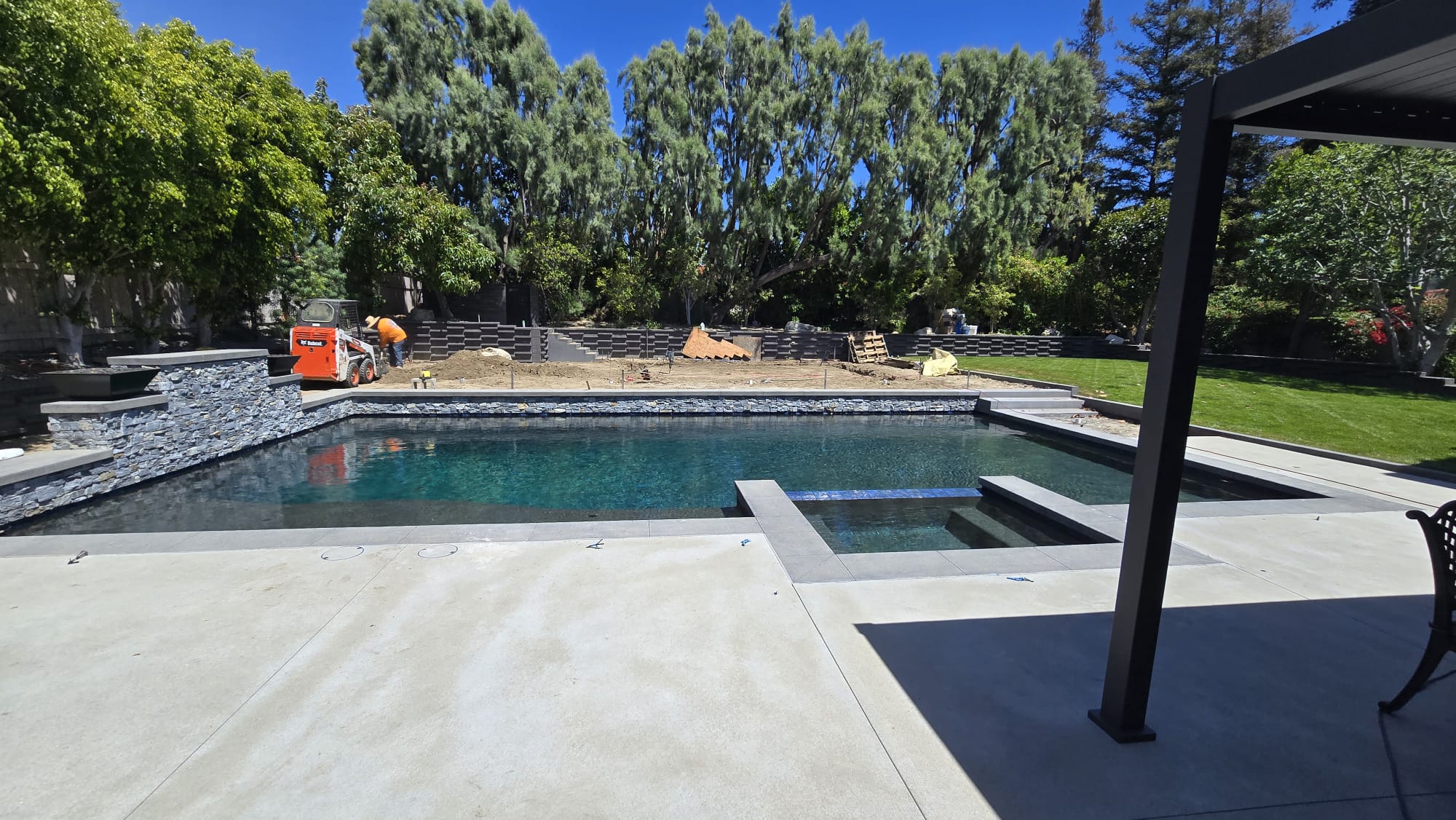 Modern pool deck with concrete coping