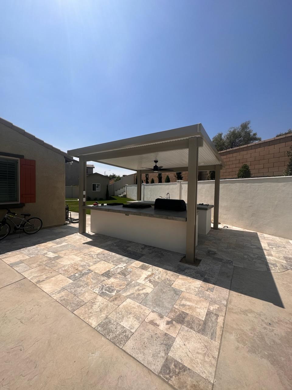 Travertine patio with outdoor kitchen